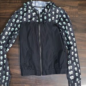 black and green windbreaker